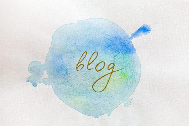 Handwritten word Blog inside of watercolour painted circle. Influencer material.